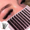 Close-up of a person applying black cluster lashes using a pink lash tray for volume extensions