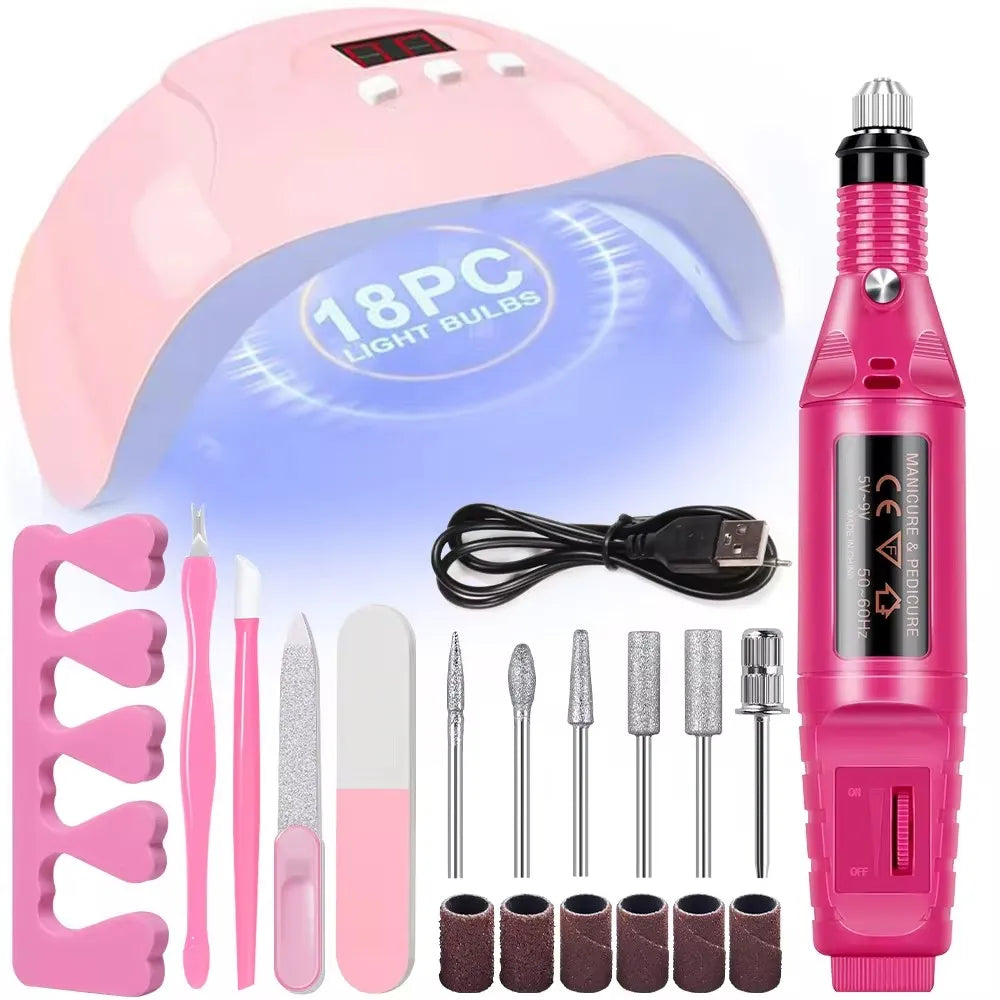 A pink professional nail care kit featuring an electric drill and various nail tools like files and buffers.