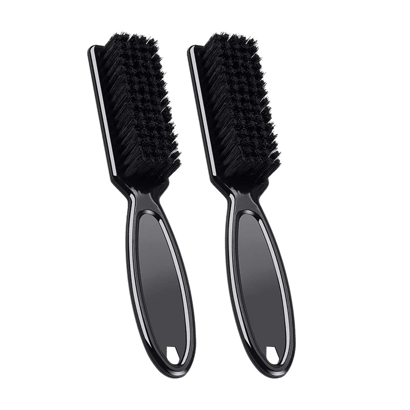 A pair of black professional neck and facial hair duster brushes.