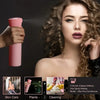 A woman models a pink hair spray bottle while looking at the camera, with related skin care and cleaning items shown below.