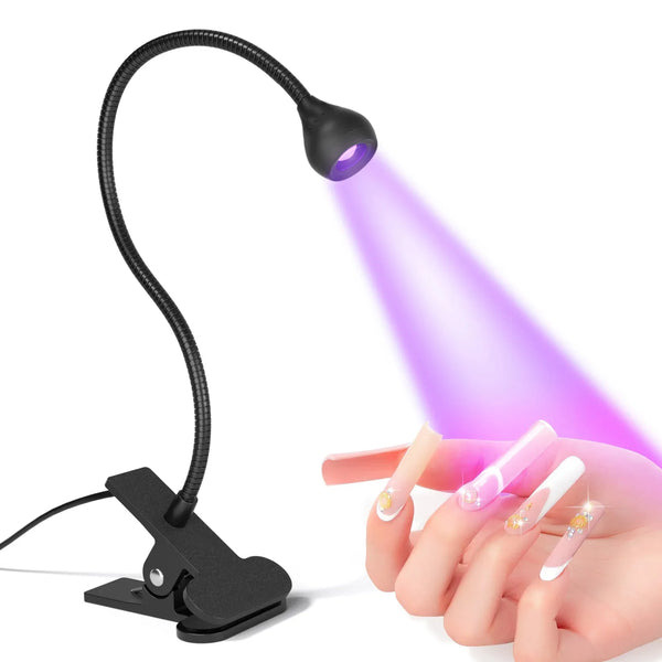 A hand holds a clip-on UV LED nail lamp with a flexible gooseneck illuminating a fingernail.