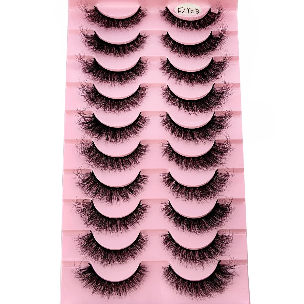 A pink plastic tray holding ten pairs of natural look false mink eyelashes.