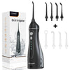 A black oral irrigator device and various tips are shown next to its packaging.