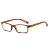 A pair of brown-framed progressive multifocal reading glasses with a gold-toned temple.