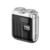 A portable silver and black electric shaver with a digital display showing 100% battery.