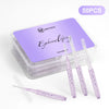 A clear container of 50 pieces of mini brow and eyelash comb set with purple tinted applicators.