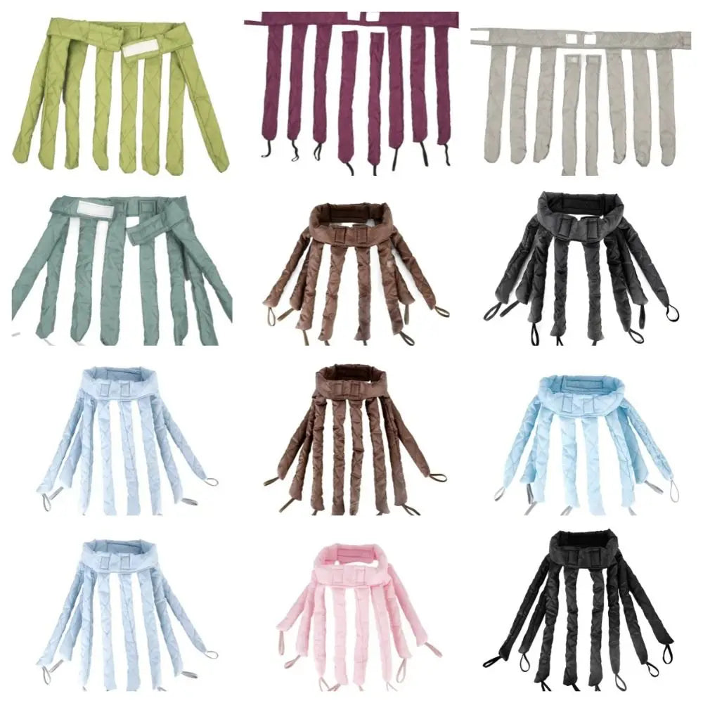 A collection of removable heatless hair curlers in various shades of green, purple, gray, and black.