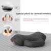 A black electric pillow designed as a special pillow for cervical vertebrae, shown next to usage instructions.