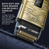 Close-up of a gold electric shaver with a shaving head resting on a dark beard.