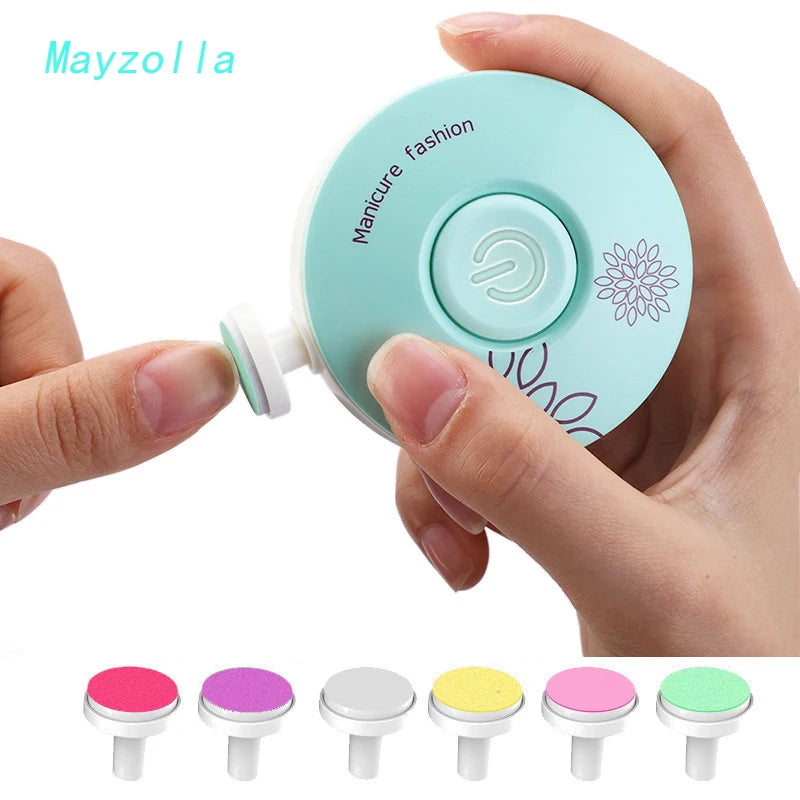A hand holds a light blue electric manicure tool with various colored tips for baby nails.