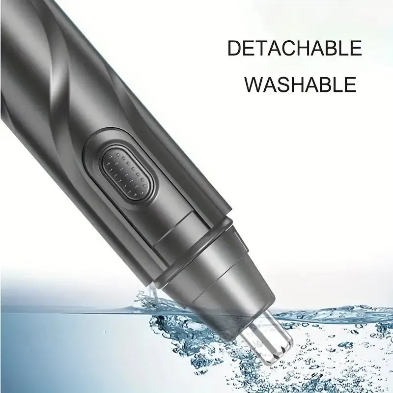 Close-up view of a detachable washable electric nose hair trimmer submerged in water.
