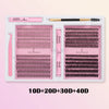 A pink kit containing lash remover tools and lash clusters for DIY eyelash extensions.