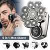 A man is using a 6-in-1 multi-function electric grooming kit for shaving, with various attachments shown below.