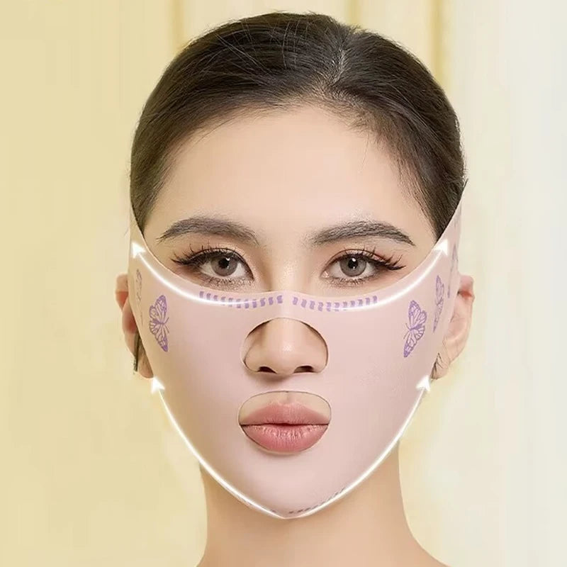 A woman is wearing a pink silicone face slimming bandage with butterfly designs on her face.