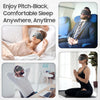 A woman wearing a pitch-black sleep mask is relaxing on a bed, demonstrating the comfortable sleep mask for anywhere, anytime