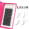 A box of XIUSUZAKI luxury eyelash extension lash kits showing various lengths and styles.