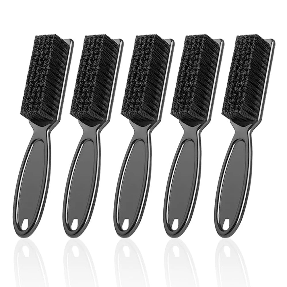 Five black plastic and nylon cleaning brushes laid out side by side
