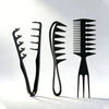A set of three black men's salon hair styling combs displayed against a white background.