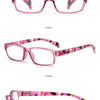 Un set de gafas de lectura rosa púrpura mostradas en varios ángulos y estilos.
