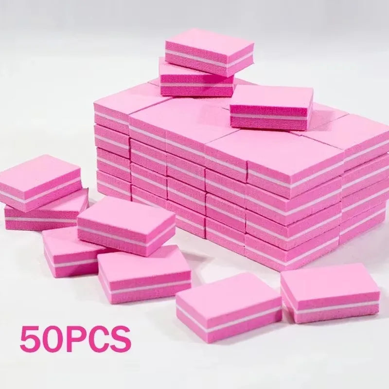 A stack of pink multi-sided nail and cuticle buffing files.