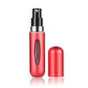 A red portable mini perfume refill spray bottle with a black pump dispenser and a separate red refill component.