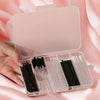 A hand holds an open clear storage case containing a set of 80 black makeup brushes.