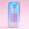 A clear electric toothbrush with a purple light glows inside, featuring a U-shaped brush head.
