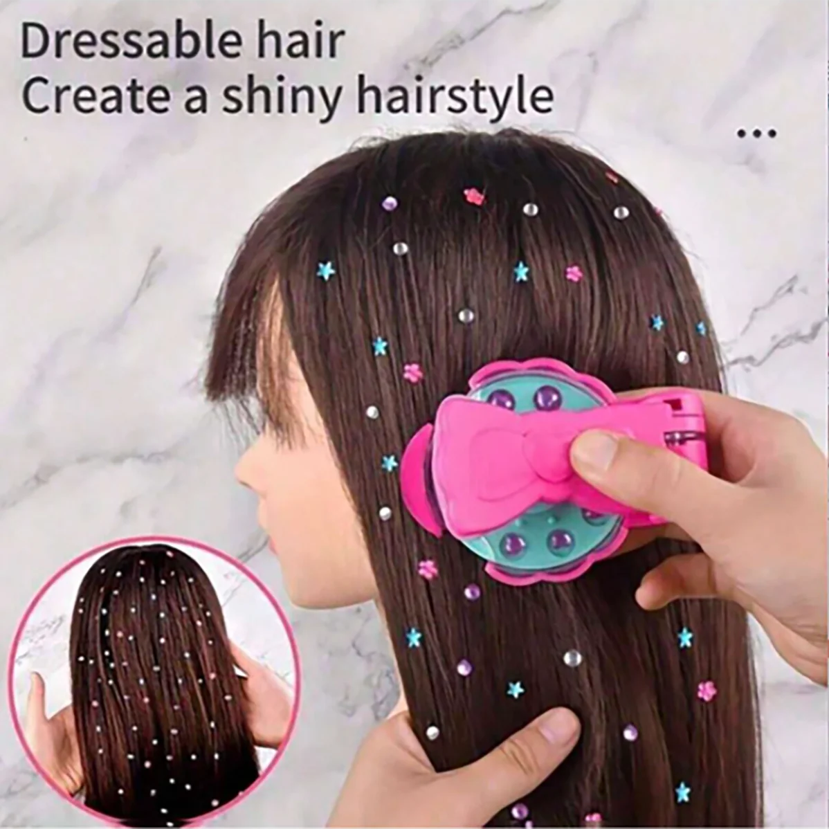 A person is using a pink hair tool to add glitter and colorful beads to dark brown hair for a shiny hairstyle.