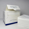 A box of clean face towels labeled for makeup and skincare is shown next to a stack of white towels.