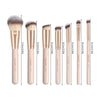 A set of seven professional makeup brushes with varying sizes and shades displayed vertically.