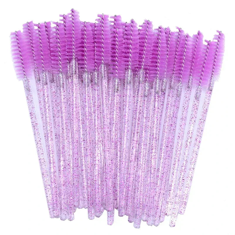 A set of disposable eyelash and eyebrow brushes in a vibrant purple color.