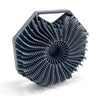 A dark gray silicone exfoliating shower scrub brush with a textured, fan-like head.