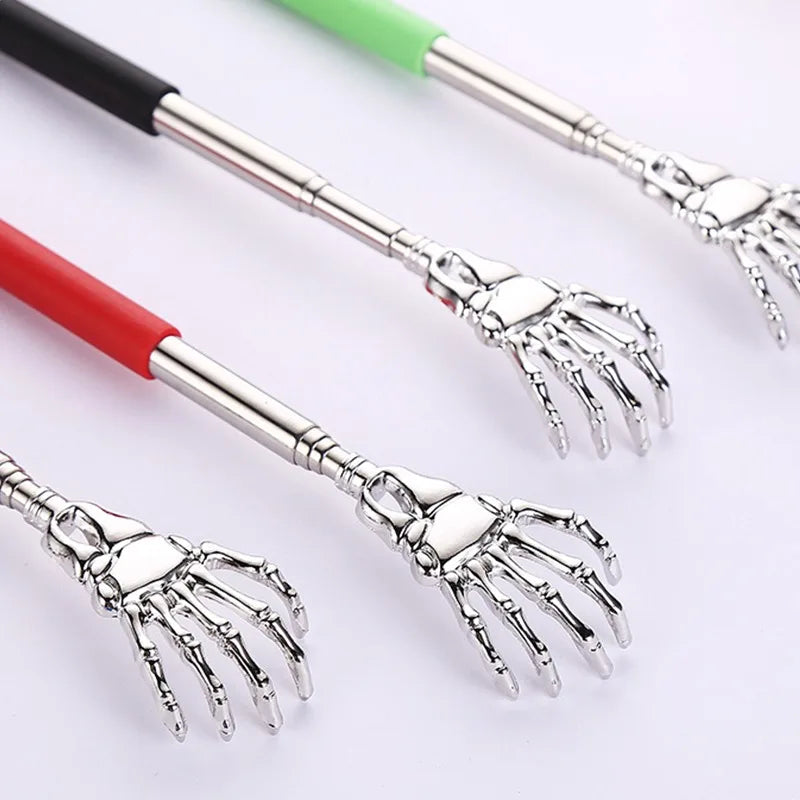 Three stainless steel telescopic back scratchers with retractable handles in black, red, and green.