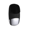 A black sonic facial cleansing brush with a silver head and body.