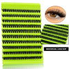 A bright lime green plastic tray holding multiple rows of individual black false eyelashes for eye extensions.