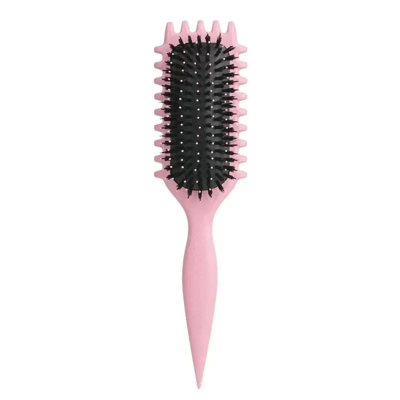 A pink tangle-free curly hair styling comb with black bristles.