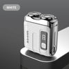 A white mini electric smart shaver resting on a dark surface.