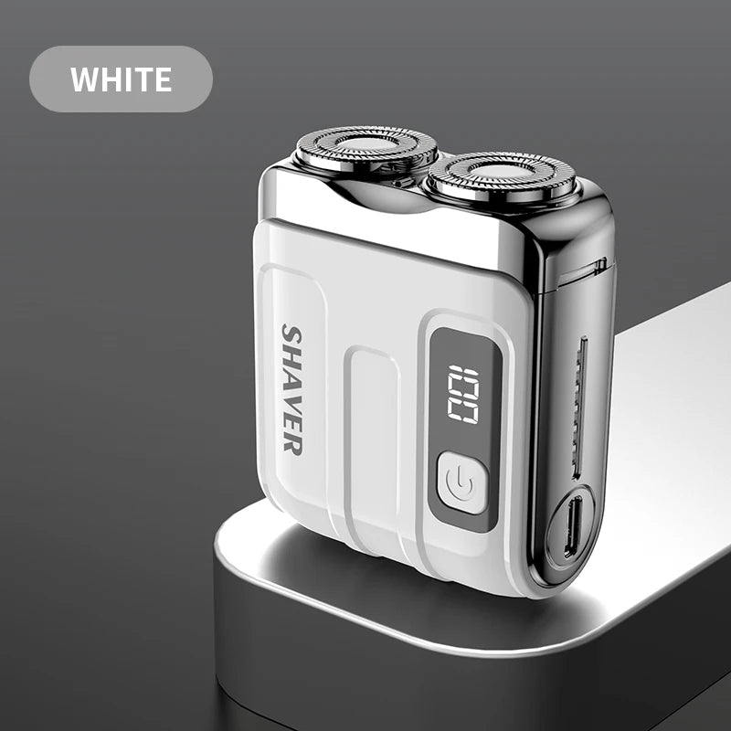 A white mini electric smart shaver resting on a dark surface.