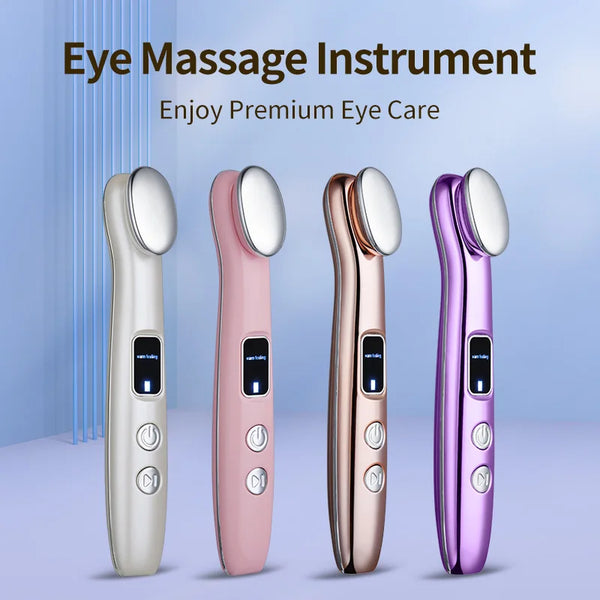 A set of four eye massage instruments in silver, pink, rose gold, and purple tones displayed against a light blue background.