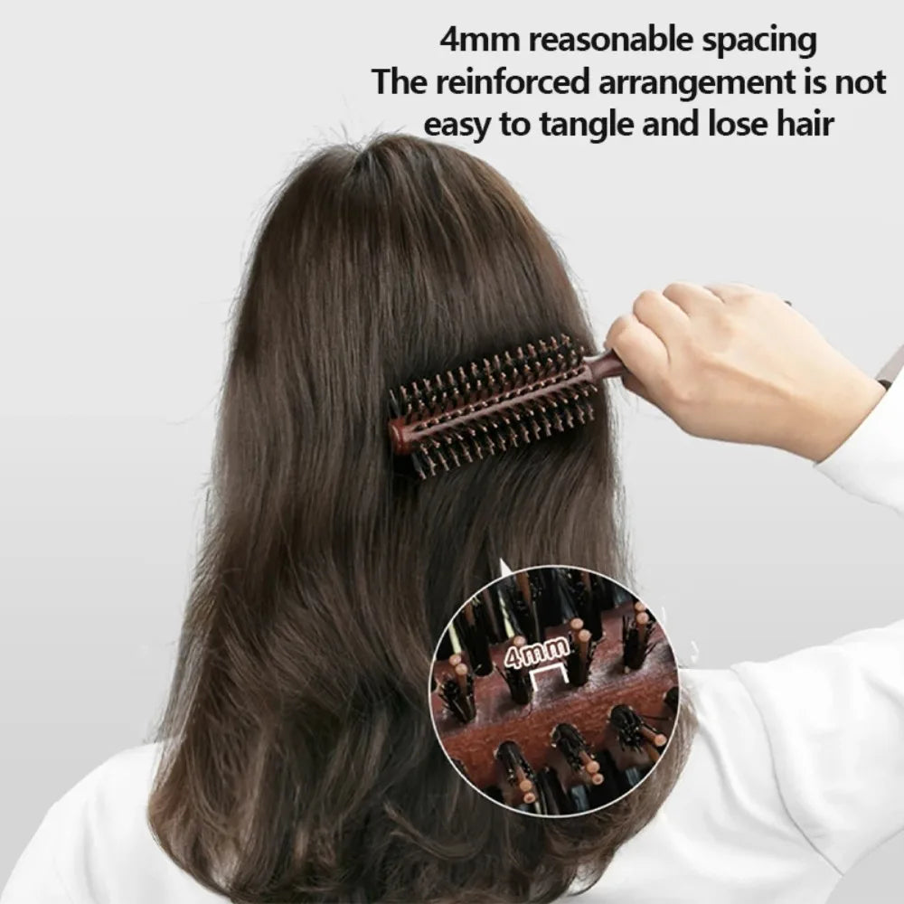A hand is using a natural boar bristle curling brush on dark hair, demonstrating 4mm spacing for loose hair.