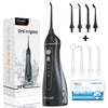 A black oral irrigator device shown next to its packaging box and various tips.