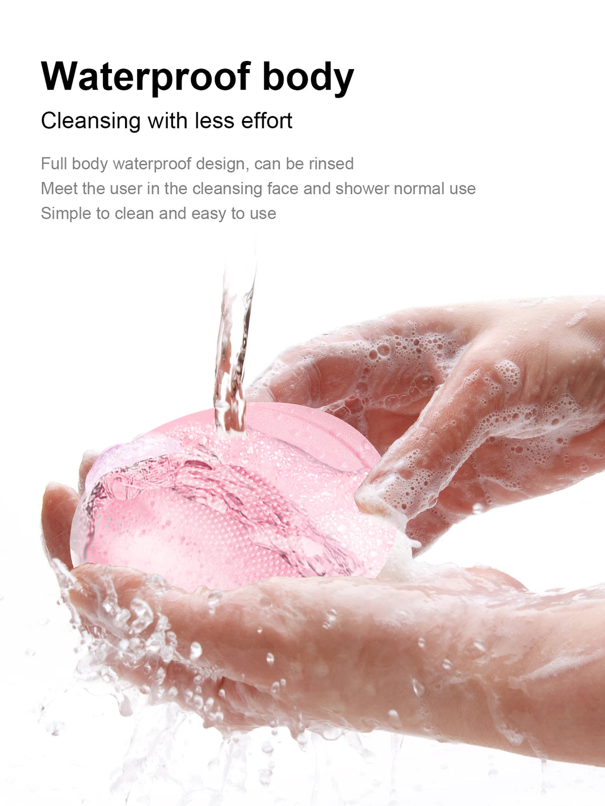 A hand is using a pink, waterproof facial cleansing brush to cleanse the skin with water.