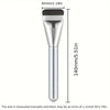A silver oval foundation brush with a dense synthetic hair and a metal ferrule.