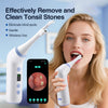 A woman is using a white precision tonsil stone remover device with an HD camera to clean her tonsils.