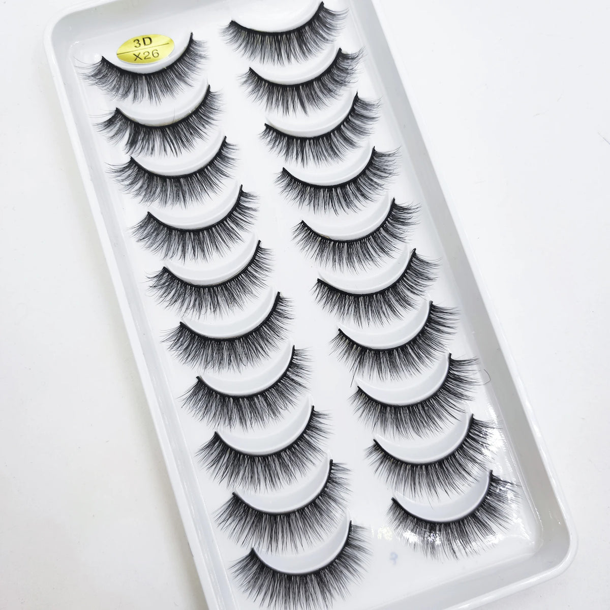 A tray of natural 3D mink false eyelashes displayed for sale.