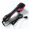 A black and pink professional ceramic hot air brush hair styling tool with a cord.