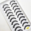 A plastic tray holding various styles of black natural 3D mink false eyelashes.