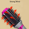 Nahaufnahme einer grauen Haarbürste mit rosa Akzenten und schwarzen Borsten, die die Upgrade-Funktion zeigt.