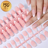 A hand displays a set of matte pink French press on artificial fingernails arranged on a pink plastic tool.