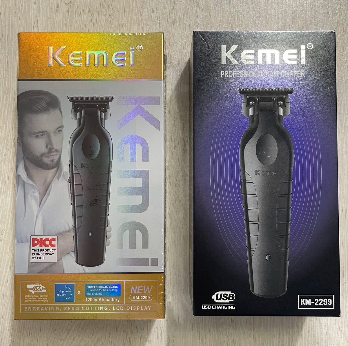 A black Kemei professional hair clipper is shown in its packaging box.